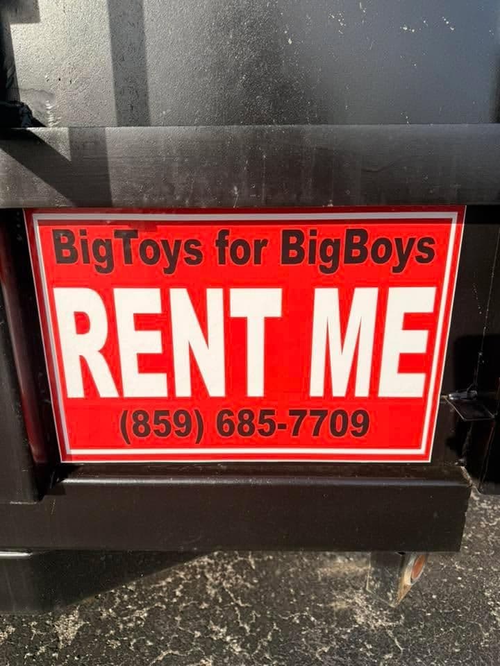 Sign for rental service "BigToys for BigBoys" with contact number (859) 685-7709.
