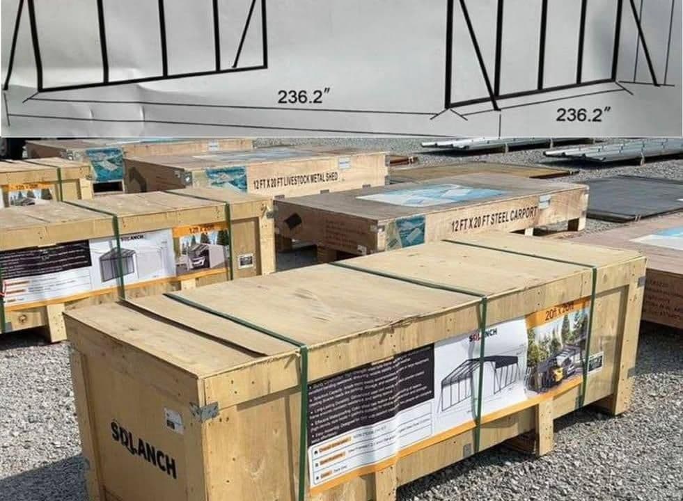 Wooden crates with steel carport kits for sale, displayed outdoors with instructional backdrop.