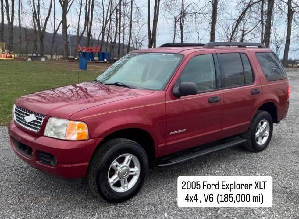2005 Ford Explorer XLT 4x4 V6 for sale, 185,000 miles, red SUV parked outdoors.